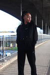 Women's tracksuit in black with embroidery signature